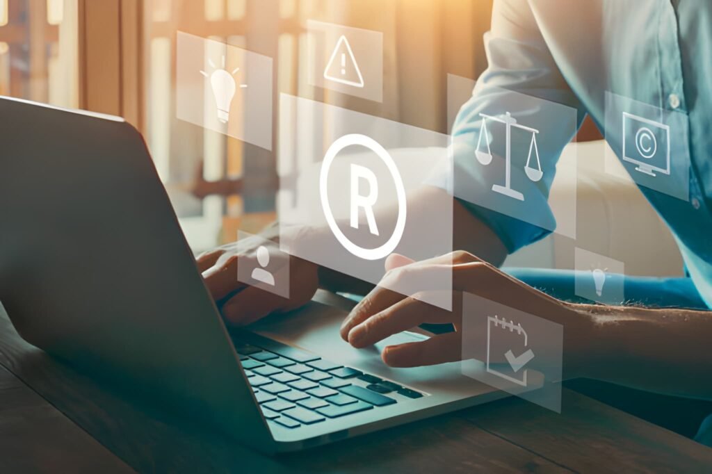 Laptop with trademark icons and text explaining Nice Classification categories.
