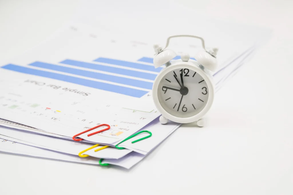legal documents with colorful paperclips, symbolizing the strict timelines for filing a Request for Examination.