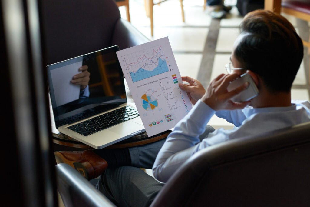 Do Market Research" next to a photo of a businessman sitting in an armchair